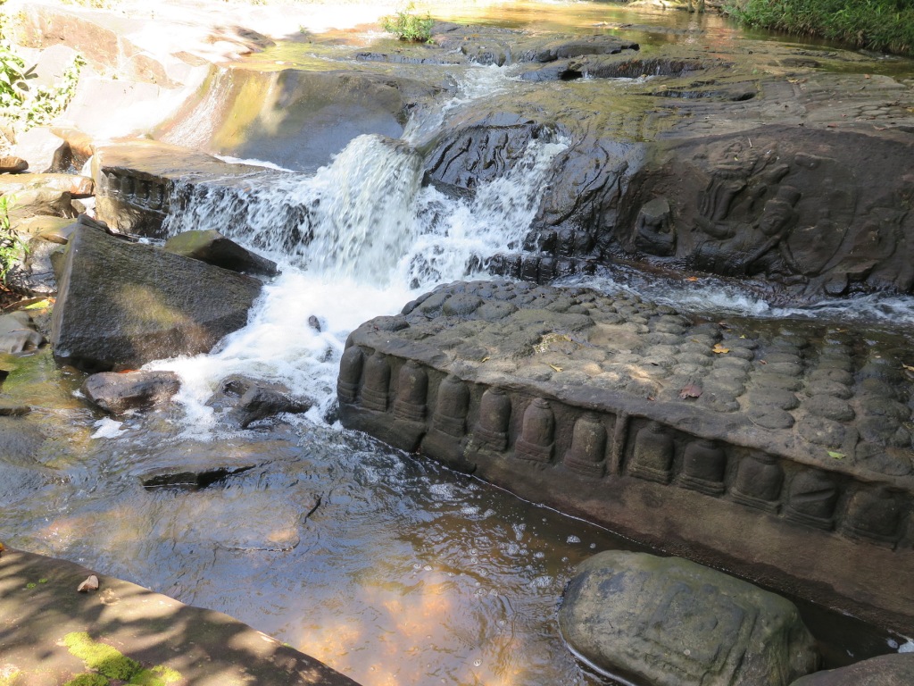Hundreds of lingas sculpted on rocks lying on the river bed of Kbal Spean