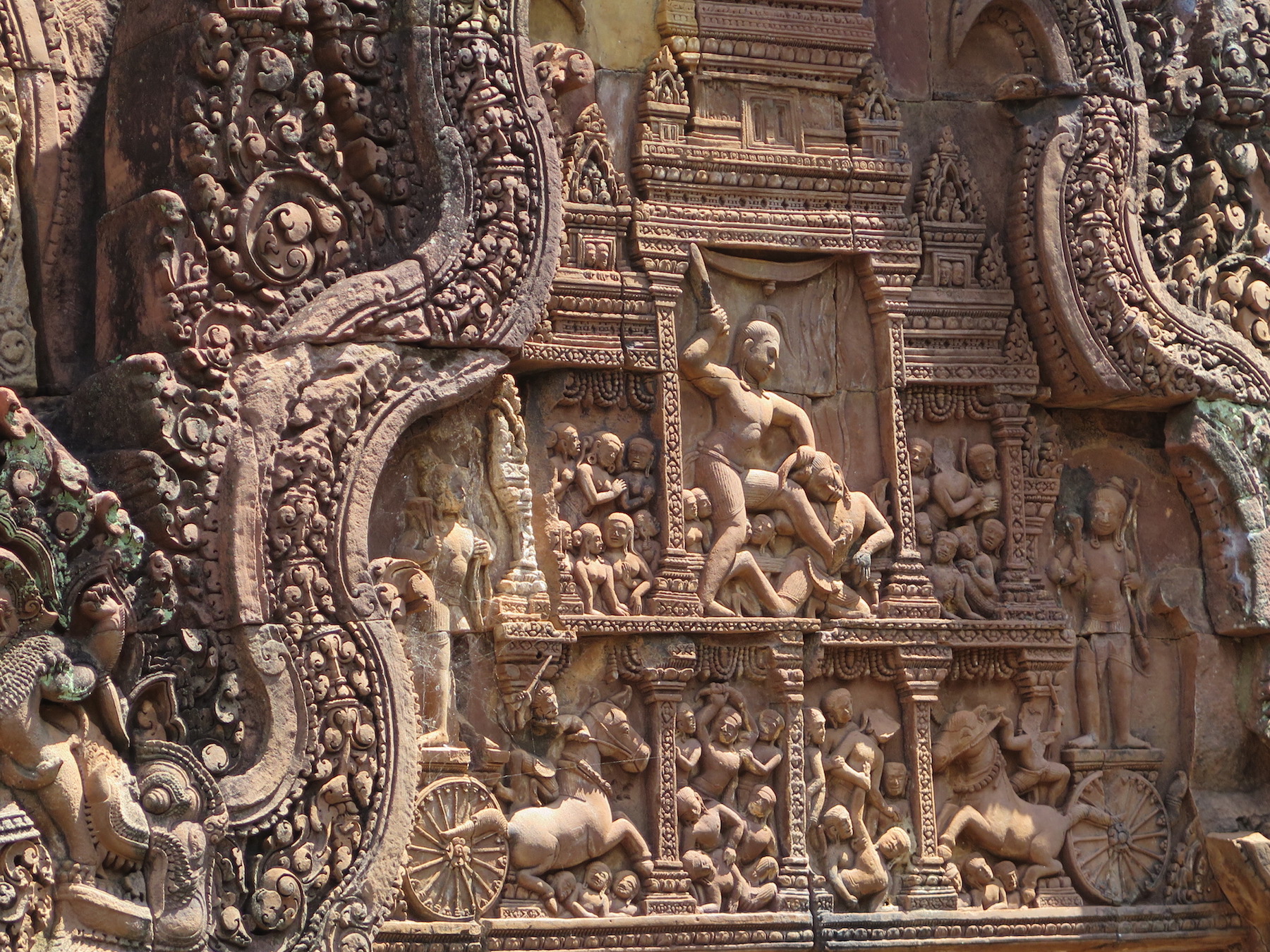 Image of Krishna holding Kamsa by Hair and piercing him with a dagger