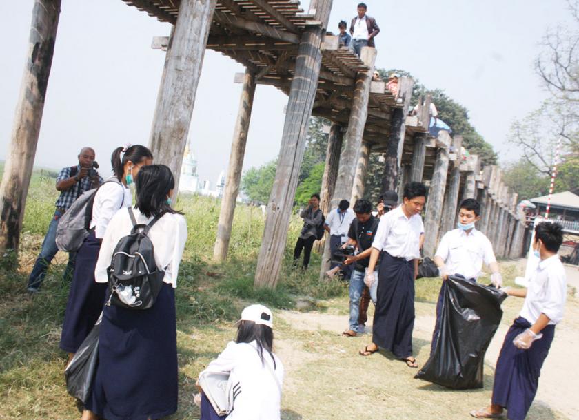Students lead the way towards bringing in a culture of cleanliess. Here they are seen participating and leading a cleanliness drive along the banks of the U-Bein bridge.