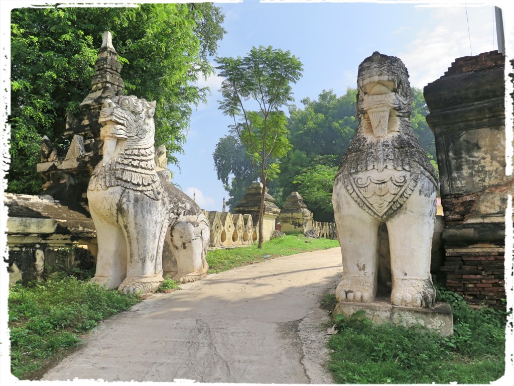 Chinthes are Leogryphs or Lion like creatures seen at the entrances of Pagodas and temples in Buddhist countries in the region. The chinthe is revered and loved by the Burmese people and is used symbolically on the royal thrones of Burma. Predating the use of coins for money, brass weights cast in the shape of mythical beasts like the chinthe were commonly used to measure standard quantities of staple items.The Chinthes seen here are at the entrance to the Maha Aung Mye Bonzan Monastery.