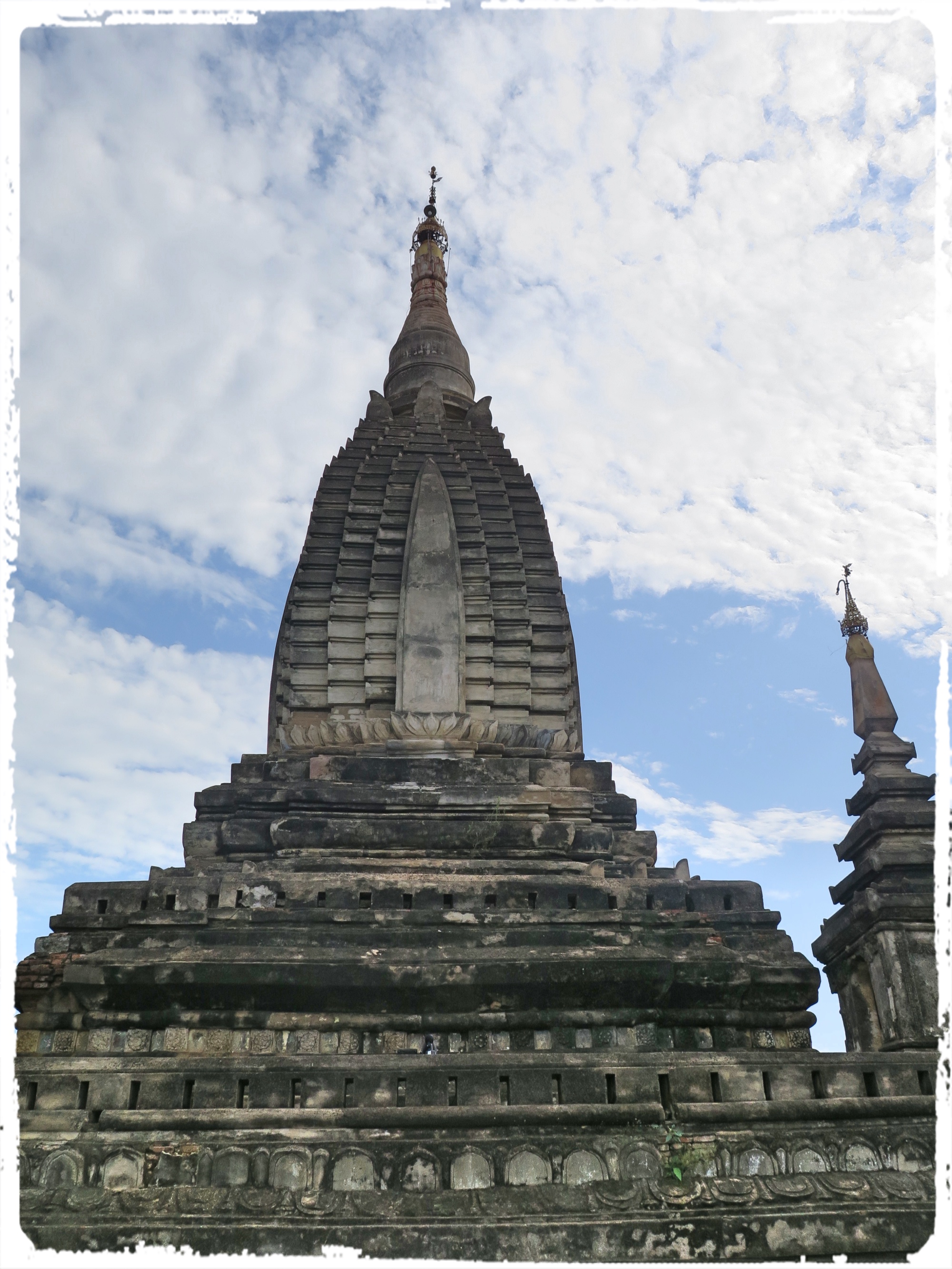 Shwegugyi means "the Golden Cave" in Myanmar. t was built by King Alaungsithu in 1140 A.D. There is a legend saying, that there was a huge block of brick about 12 feet high sprouted from the ground in response to the king's greatness of accumulated merit. So with the huge block of brick, formed the plinth in the formation of the temple. It was mentioned that the Shwegugyi was completed in 7 months and 7 days. (Courtesy : http://bagan.travelmyanmar.net)