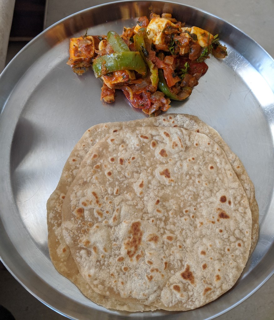 Kadai Paneer with 2 chapatis in a plate