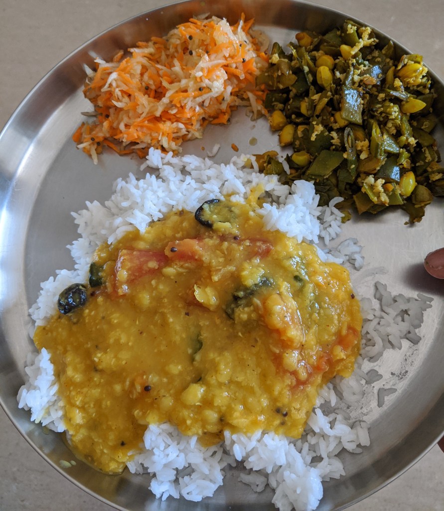 Rice with Amti, Broad beans curry and a grated salad