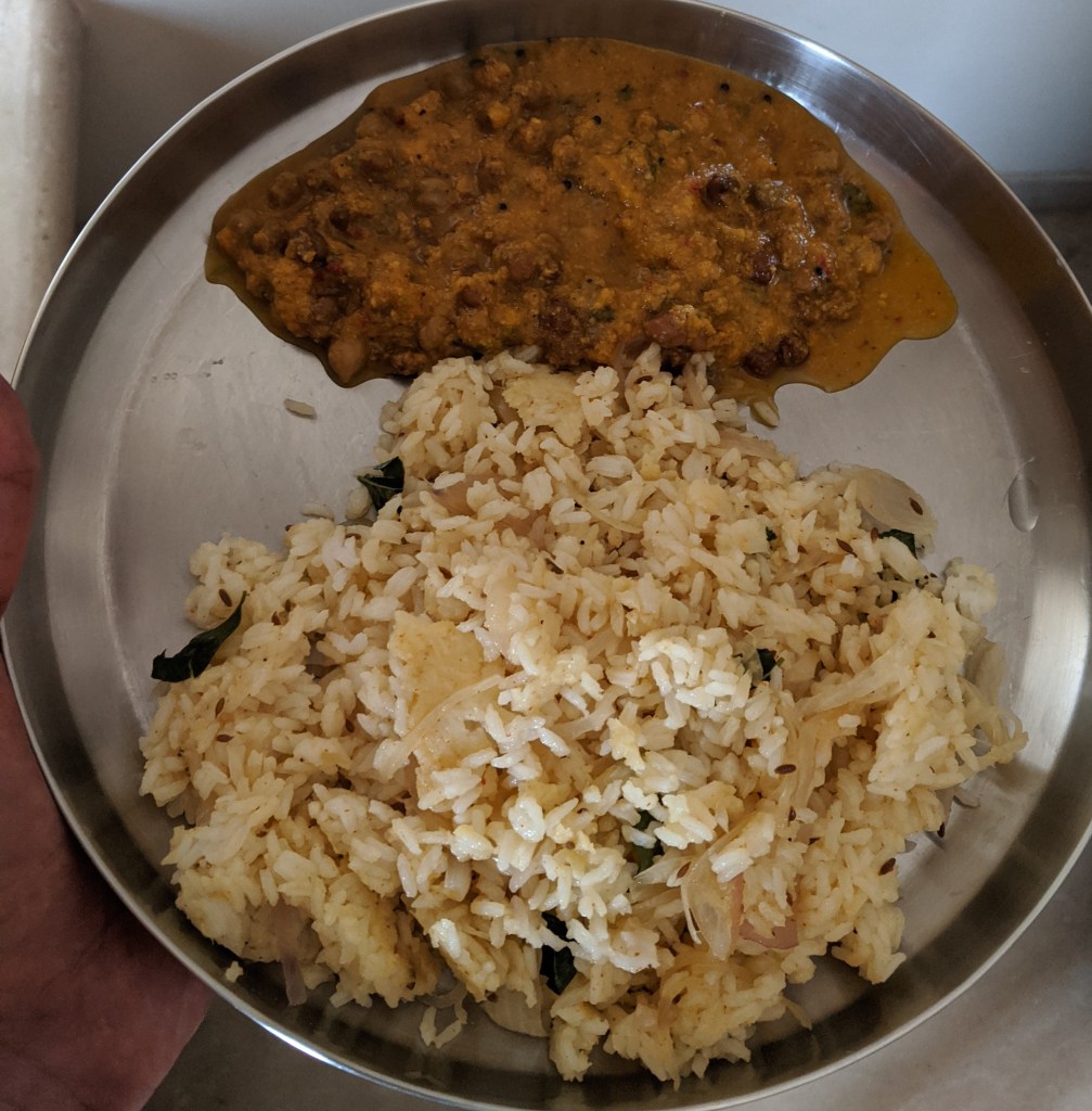 Onion rice with kadalai or black chickpea gravy which was a tomato onion based one