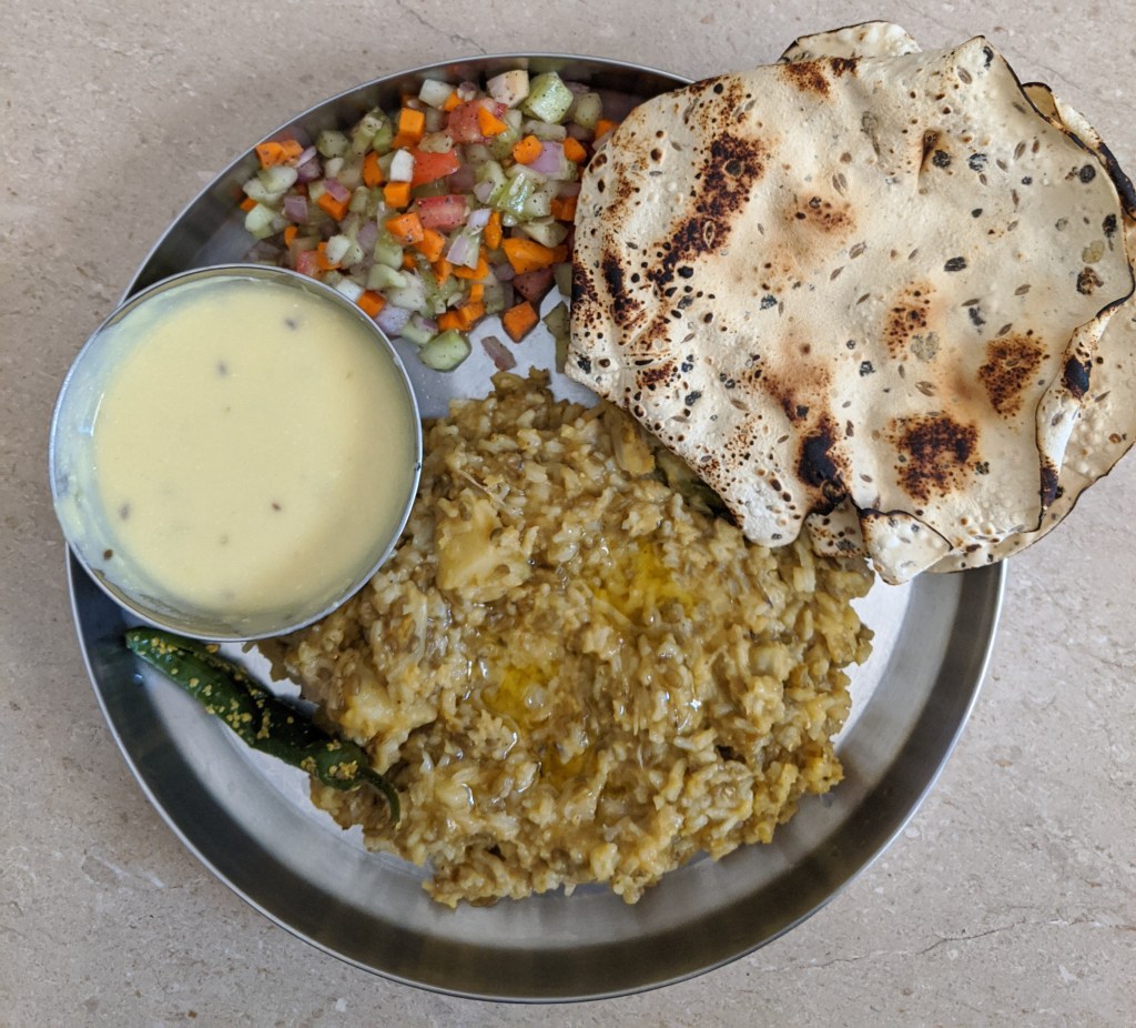 Vegetable khichdi, Gujarati kadi, athanu marcha, some salad and of course a Gujarati papad