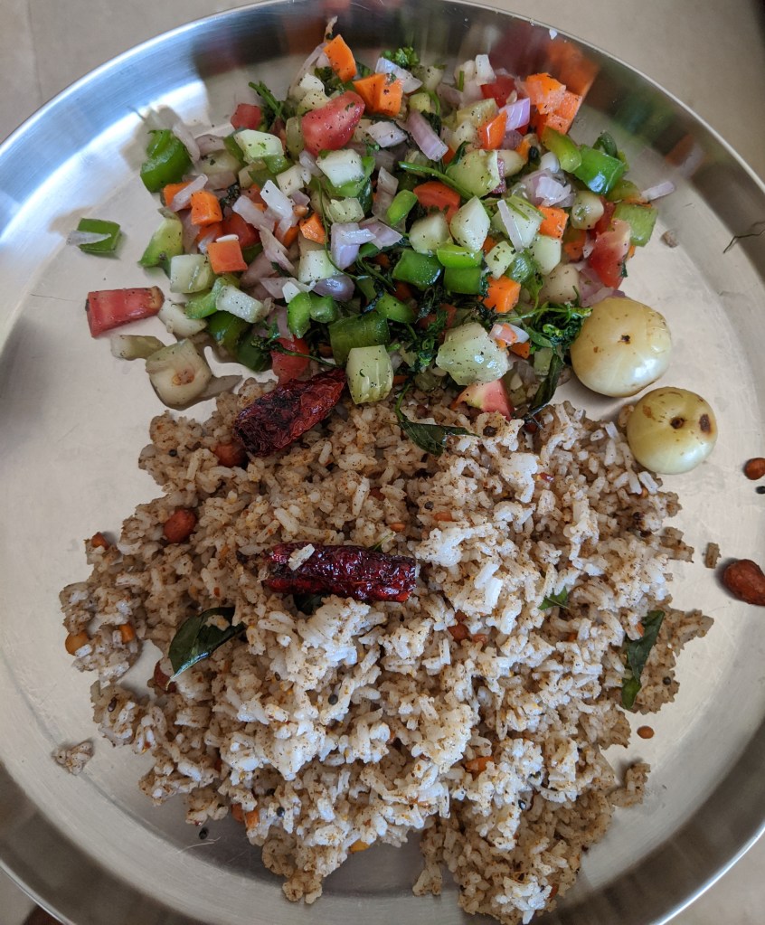 rice mixed with sesame powder and tempered with some peanuts, curry leaves, chana dal and some red byadgi chillies. Some salad and steamed gooseberries for immunity