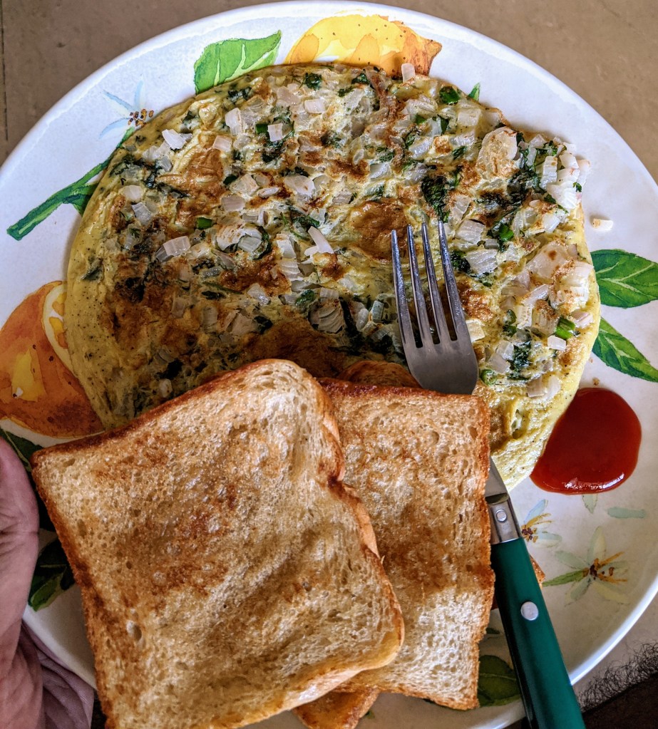 A great 2 egg omlette with three slices of brown bread for a great breakfast on saturday