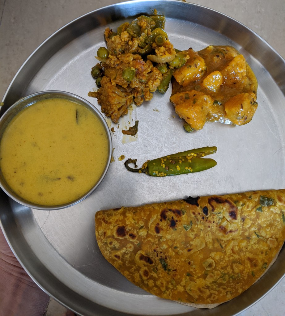 Plating the food along with a piece of chilli